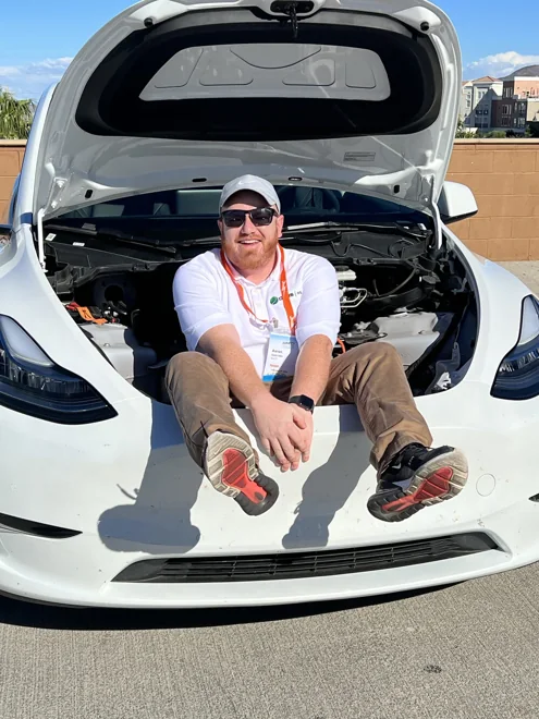 Aaron Jones seated at the front of an electric vehicle