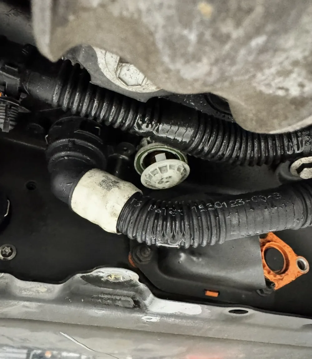 Close-up of residue around a vehicle hose connection