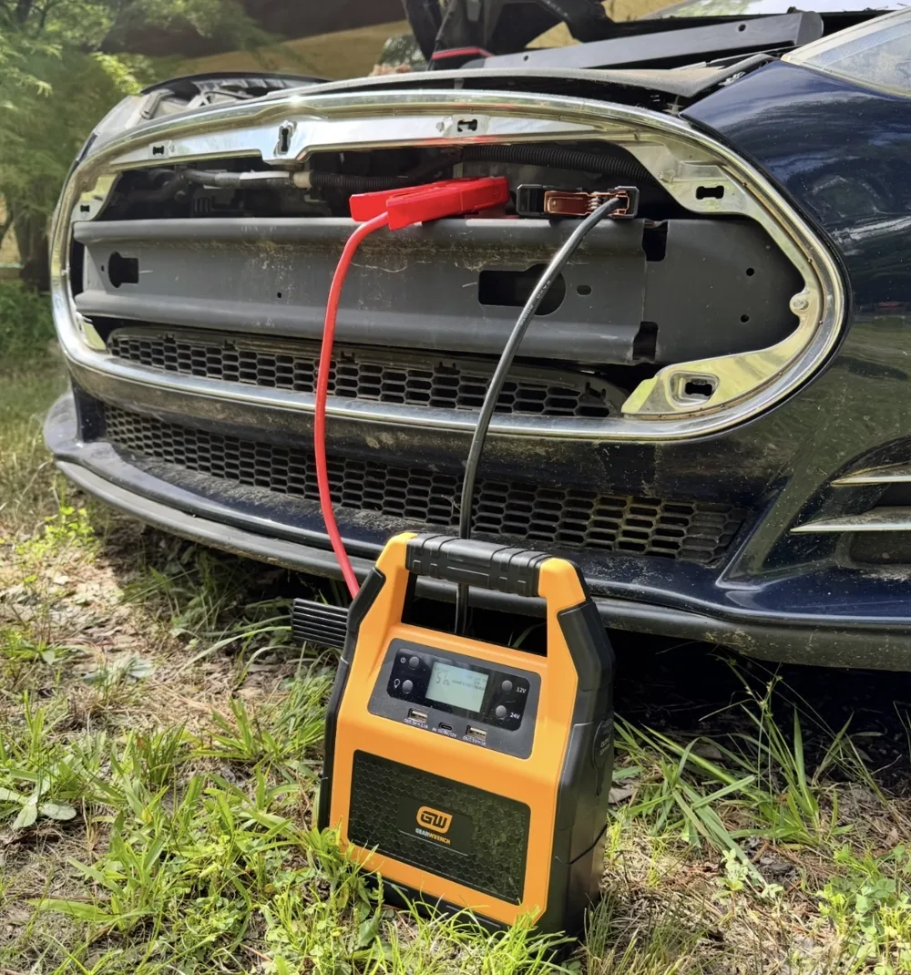 Portable low-voltage support equipment connected to an electric vehicle